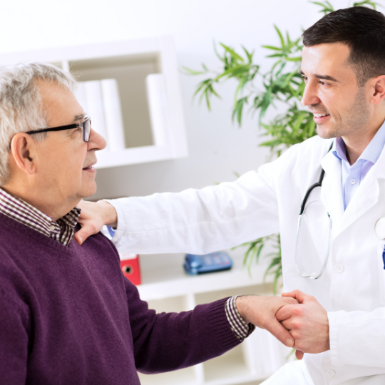 Doctor speaking with elderly patient